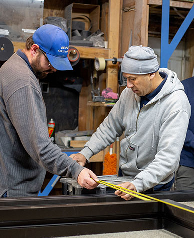 Bennett Glass and Mirror glass shop employee smiling in office