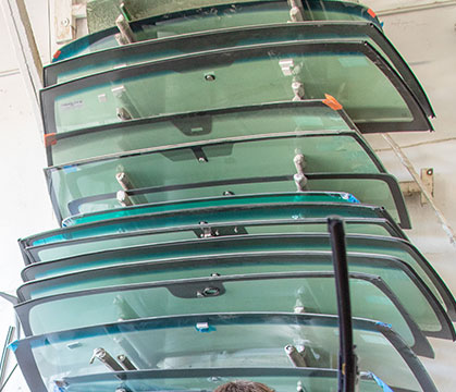 Bennett Glass and Mirror in Prescott, Arizona employee holding replacement windshield