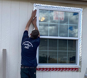 Bennett Glass and Mirror glass shop employee replacing car windshield