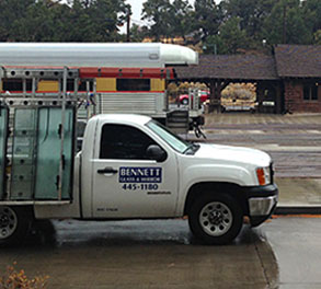 Bennett Glass and Mirror service van parked in front of house