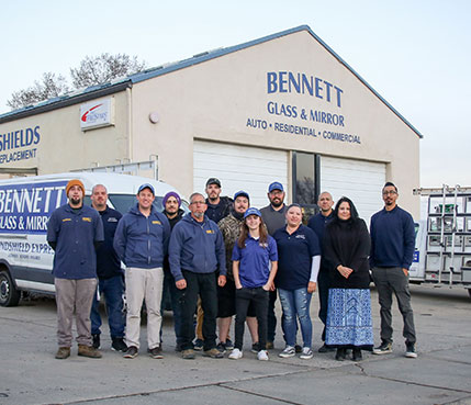 Bennett Glass and Mirror employees standing outside office
