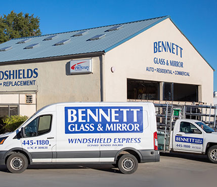Bennett Glass and Mirror service vans parked outside glass shop