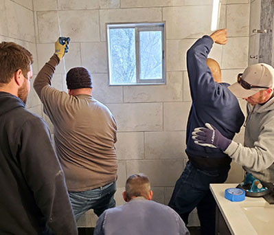 Bennett Glass and Mirror glass shower installation crew installing a custom residential glass shower enclosure in Prescott, Arizona